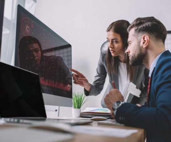 selective-focus-of-information-security-analysts-using-charts-on-computer-monitors-while-working-in-1024x684